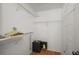 Walk in closet with custom shelving, a wood floor and a wall mounted safe at 8617 Se 141St Street Rd, Summerfield, FL 34491