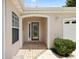 Charming front entrance with decorative glass door, brick paving, and arched entryway at 8617 Se 141St Street Rd, Summerfield, FL 34491