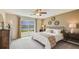 This bedroom features lots of natural light, a large window, and modern décor at 8653 Sw 44Th Ter, Ocala, FL 34476