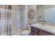 Bathroom featuring a shower, and single vanity with solid surface counters and modern fixtures at 8659 Sw 44Th Ter, Ocala, FL 34476