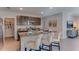 Modern kitchen with stainless steel appliances, granite countertops, and a convenient breakfast bar at 8659 Sw 44Th Ter, Ocala, FL 34476