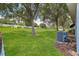 Expansive backyard featuring lush green grass and mature trees at 9287 Sw 91St Court Rd, Ocala, FL 34481