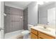 This bathroom features a tiled shower and modern sink and cabinet at 9287 Sw 91St Court Rd, Ocala, FL 34481