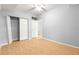 Neutral bedroom featuring a sliding door closet and light wood flooring at 9287 Sw 91St Court Rd, Ocala, FL 34481