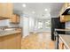 Well-organized kitchen with light-wood cabinets, ample counter space, and a convenient layout for cooking at 9287 Sw 91St Court Rd, Ocala, FL 34481