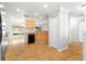 Efficient kitchen design with black appliances and a convenient workflow, great for everyday meals at 9287 Sw 91St Court Rd, Ocala, FL 34481