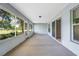 View of the home's screened patio and sliding doors at 9287 Sw 91St Court Rd, Ocala, FL 34481