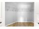 Walk-in closet with installed shelving, rods, and light-colored wood flooring at 9287 Sw 91St Court Rd, Ocala, FL 34481