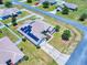 Home featuring solar panels on the roof, enhanced by a manicured lawn in a peaceful neighborhood at 9677 Sw 56Th Cir, Ocala, FL 34476