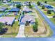 Aerial view of home with solar panels on the roof, set within a fenced yard in a residential neighborhood at 9677 Sw 56Th Cir, Ocala, FL 34476