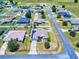 Aerial view of a community featuring homes with well-maintained yards, trees, and quiet residential streets at 9677 Sw 56Th Cir, Ocala, FL 34476