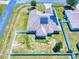 An aerial view of home with solar panels and a fenced backyard in a vibrant neighborhood at 9677 Sw 56Th Cir, Ocala, FL 34476