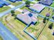 Aerial perspective showcasing the home's solar panel install, backyard, and neighborhood setting at 9677 Sw 56Th Cir, Ocala, FL 34476