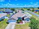 Expansive aerial view of a single-story home with a landscaped yard in a quiet residential neighborhood at 9677 Sw 56Th Cir, Ocala, FL 34476