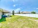View of spacious backyard with full fence and a covered patio at 9677 Sw 56Th Cir, Ocala, FL 34476