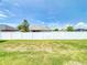 The back yard of the home has full fence and a generous grassy area at 9677 Sw 56Th Cir, Ocala, FL 34476