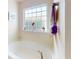 Relaxing bathtub with a window to let in natural light for a spa-like experience at 9677 Sw 56Th Cir, Ocala, FL 34476