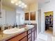 Bathroom with double sinks, attractive vanity, lots of lights and walk-in shower at 9677 Sw 56Th Cir, Ocala, FL 34476