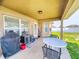 The home has a spacious covered patio and includes BBQ and table with chairs at 9677 Sw 56Th Cir, Ocala, FL 34476