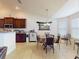 Bright dining area features tile floors, pendant lighting, and views into the kitchen at 9677 Sw 56Th Cir, Ocala, FL 34476