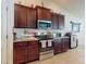Beautiful kitchen with stainless steel appliances, granite countertop, and ample cabinet space at 9677 Sw 56Th Cir, Ocala, FL 34476