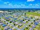 An expansive aerial view of a large community with tree-lined streets and well-spaced homes at 9677 Sw 56Th Cir, Ocala, FL 34476