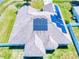An aerial view of roof highlighting installed solar panels on a well-maintained roof at 9677 Sw 56Th Cir, Ocala, FL 34476