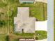 Aerial view of a well-maintained property featuring a screened lanai at 9958 Sw 59Th Cir, Ocala, FL 34476