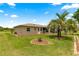 Well maintained backyard featuring a decorative landscaped flower bed at 9958 Sw 59Th Cir, Ocala, FL 34476