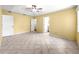 Spacious primary bedroom features tile flooring and a ceiling fan at 9958 Sw 59Th Cir, Ocala, FL 34476
