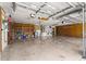Large garage featuring high ceilings, shelving, and laundry hookups at 9958 Sw 59Th Cir, Ocala, FL 34476