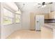 Bright eat-in kitchen featuring tile flooring, ample windows, and light wood cabinets at 9958 Sw 59Th Cir, Ocala, FL 34476