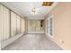 Bright sunroom with ample windows, a ceiling fan, and doors leading to the exterior at 9958 Sw 59Th Cir, Ocala, FL 34476