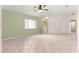 Spacious living room with tile floors, ceiling fan and a view of the exterior at 9958 Sw 59Th Cir, Ocala, FL 34476