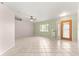 Bright living room with tile floors, and natural light, creating a comfortable and inviting space at 9958 Sw 59Th Cir, Ocala, FL 34476