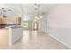 Bright living room featuring a view to the kitchen and front door at 9958 Sw 59Th Cir, Ocala, FL 34476