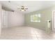 Bright living room with tile floors, and natural light, creating a comfortable and inviting space at 9958 Sw 59Th Cir, Ocala, FL 34476