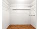 Walk-in closet with wire shelving and laminate floors at 9958 Sw 59Th Cir, Ocala, FL 34476