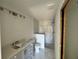 Bathroom featuring a marble-tiled shower, vanity, toilet, and fixtures at 1057 Nw 68Th Pl, Ocala, FL 34474