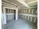 Bedroom featuring unfinished drywall walls and a doorway leading to another room at 1057 Nw 68Th Pl, Ocala, FL 34474