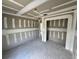 Bedroom showcasing unfinished drywall, smooth concrete floors, and open doorway at 1057 Nw 68Th Pl, Ocala, FL 34474