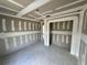 Interior of room shows freshly installed drywall and tape awaiting paint, featuring recessed ceiling lights at 1057 Nw 68Th Pl, Ocala, FL 34474