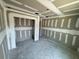 Interior of the room shows freshly installed drywall and tape awaiting paint, and recessed ceiling lights at 1057 Nw 68Th Pl, Ocala, FL 34474