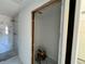 Walk-in closet area with view of the marble-tiled shower/tub at 1057 Nw 68Th Pl, Ocala, FL 34474