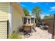 Back patio featuring brick pavers, a yellow exterior wall, and outdoor seating at 11245 Sw 63Rd Terrace Rd, Ocala, FL 34476