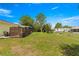 Spacious fenced backyard features a covered patio with a privacy screen, perfect for outdoor relaxation and entertaining at 11245 Sw 63Rd Terrace Rd, Ocala, FL 34476