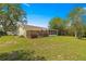 This home features a large backyard with plenty of green space, mature trees, and a screened in patio at 11245 Sw 63Rd Terrace Rd, Ocala, FL 34476