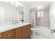 Well-lit bathroom with a vanity, modern fixtures, tub, and shower at 11245 Sw 63Rd Terrace Rd, Ocala, FL 34476