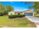 Well-maintained single-story home boasts manicured hedges and a gray two-car garage at 11245 Sw 63Rd Terrace Rd, Ocala, FL 34476