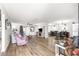 A spacious living area seamlessly blends into the dining room, featuring light wood floors and neutral decor at 11245 Sw 63Rd Terrace Rd, Ocala, FL 34476